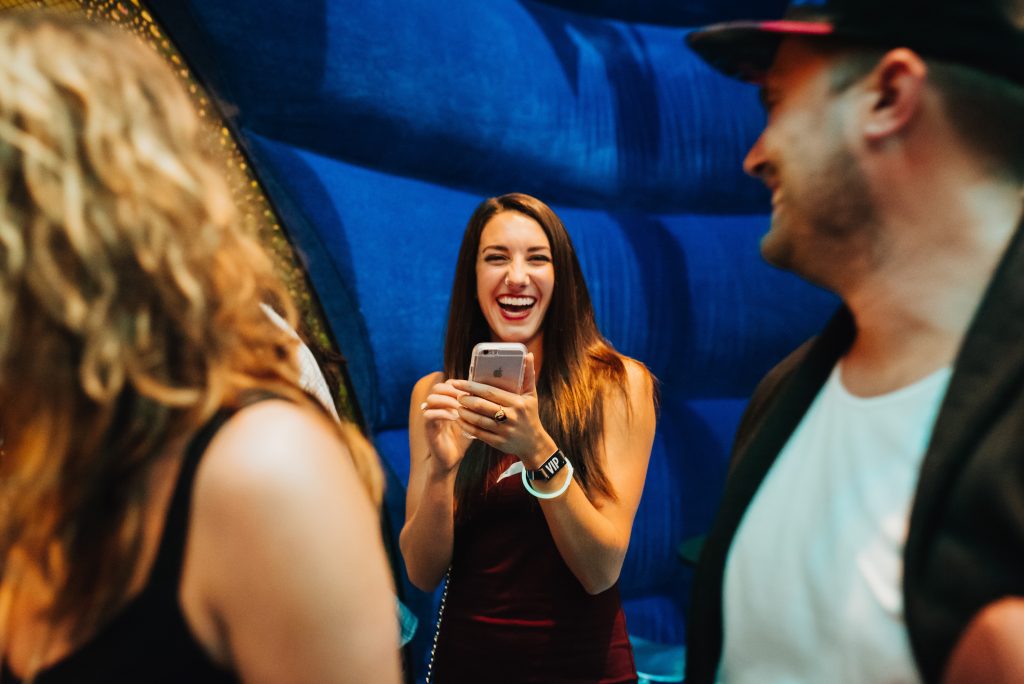 Woman laughing with phone