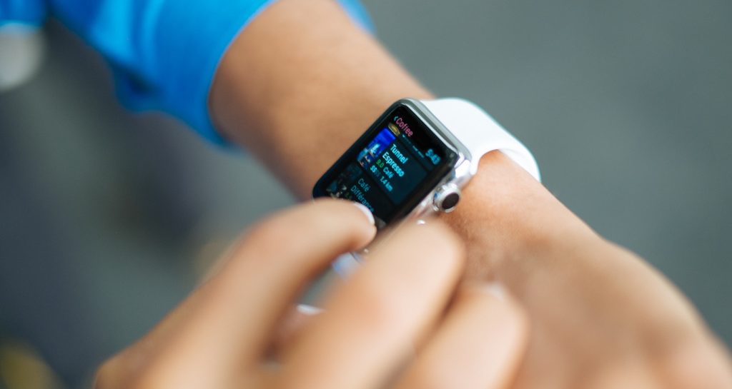 A customer uses his smart watch to order coffee.