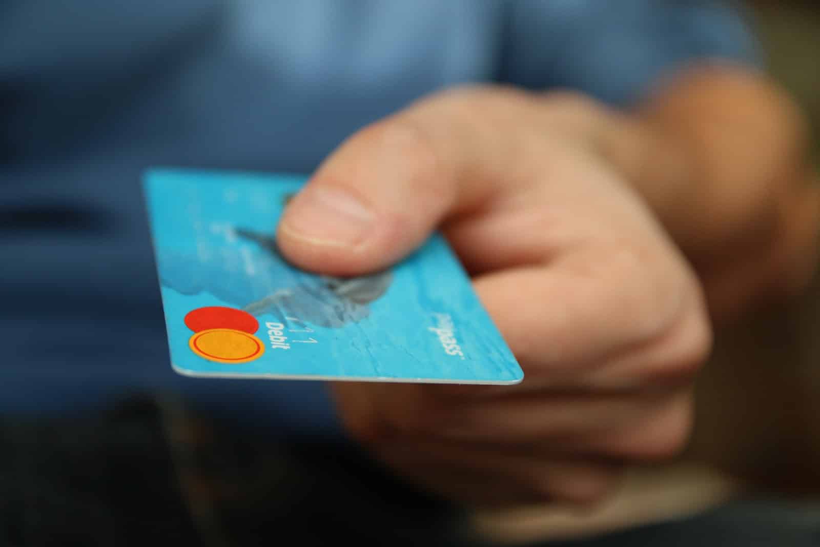 Man holding a credit card in the new era of retail.