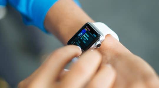 A customer uses his smart watch to order coffee.