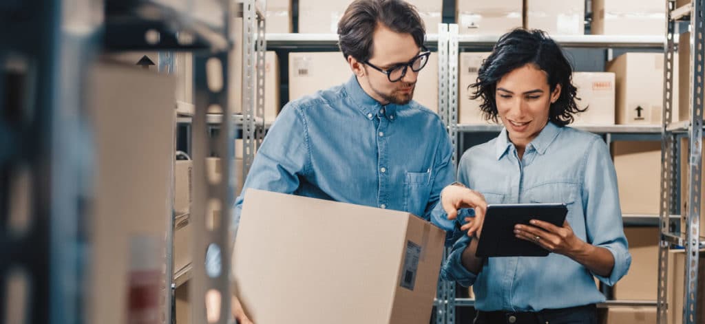 Image of two people in e-commerce product warehouse