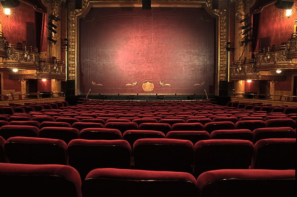 Image of a theater stage and seats