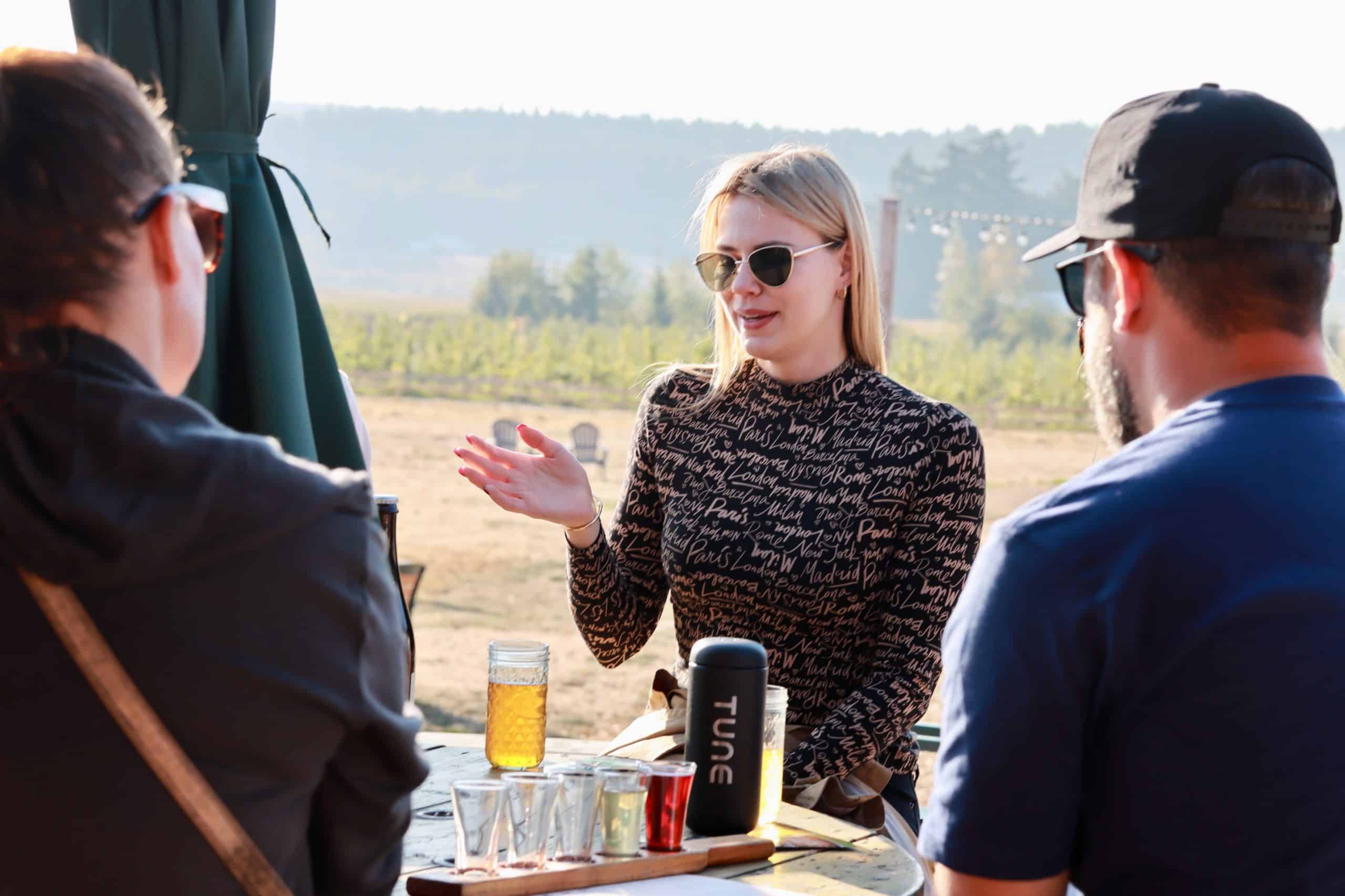 Iana chats with coworkers after the Finnriver Cidery tour during the TUNE retreat