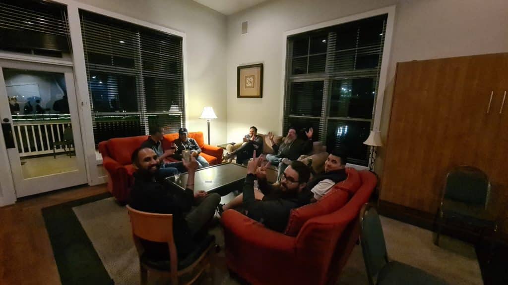 TUNE employees chill on couches after a fun day at the retreat