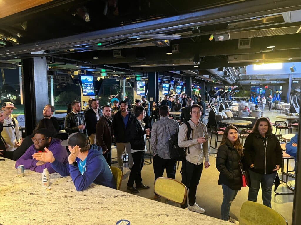 Line for TUNE + Fluent happy hour at Topgolf Las Vegas during Affiliate Summit West 2023