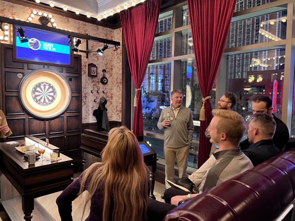 Attendees playing darts at the TUNE Happy Hour in Flight Club Las Vegas during Affiliate Summit West